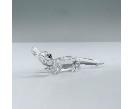 Clear faceted crystal figure of a alligator with blue green eyes. Swarovski swan mark. Part of the Endangered Species collect