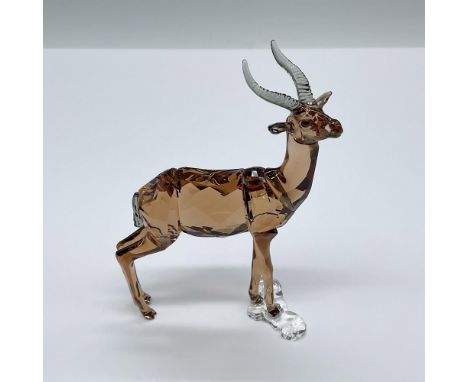 A stunning light brown crystal gazelle with smoky-grey antlers. Swarovski swan mark. This item has its original box: 6"L x 6"