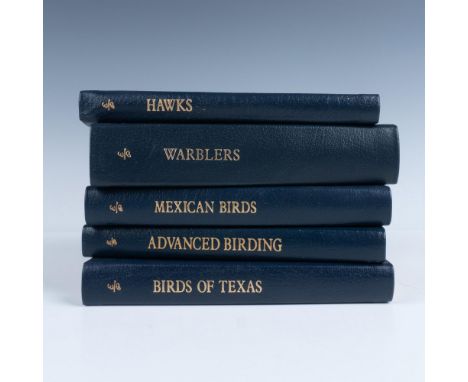 A set of 5 collector's Lifetime edition bound field guides in dark blue genuine leather covers with light blue bookmark ribbo