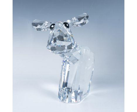 This is a Swarovski crystal moose figurine, featuring a faceted clear body with smooth antlers and dark crystal eyes. This it