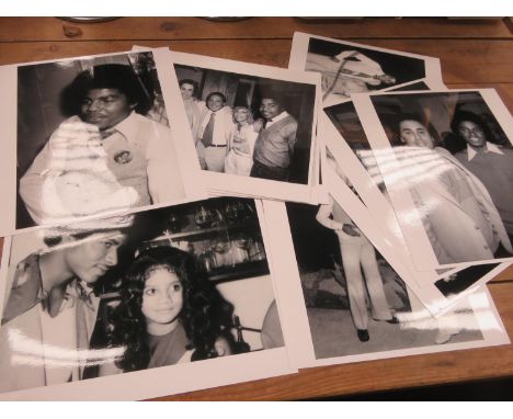 A collection of 12 black and white photographs of Michael Jackson and various Jackson family members (12) 