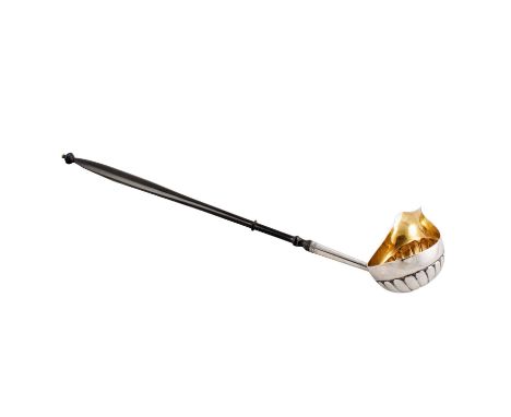 A George III silver metal toddy ladle, c.1800, the ribbed 'sauce boat' shaped silver metal bowl with shaped spout, the turned