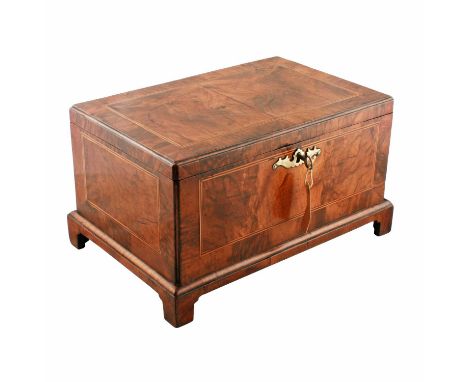A George I figured walnut veneered document box, c.1720, rectangular with crossbanding, line inlay and moulded edges, on brac