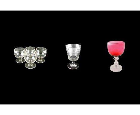 A Victorian ruby glass goblet c.1860, with ruby glass bowl, clear glass hollow knop baluster stem, and a slightly raised foot