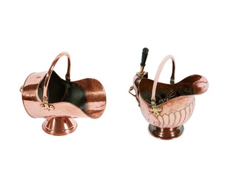 A late Victorian copper helmet-shaped coal scuttle and shovel, c.1900, with embossed shell decoration to the body and a swing