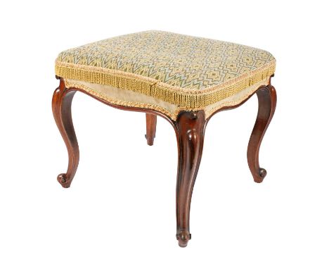 A Victorian mahogany stool, the rectangular tapestry seat with a tasselled edge over a serpentine shaped apron, raised on cab