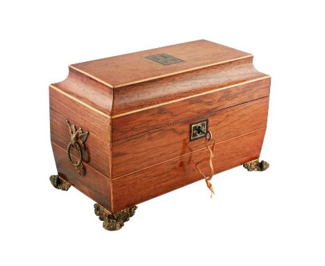 A Regency rosewood sarcophagus-shaped tea caddy, the hinged cover opening to reveal two removable rosewood tea canisters and 
