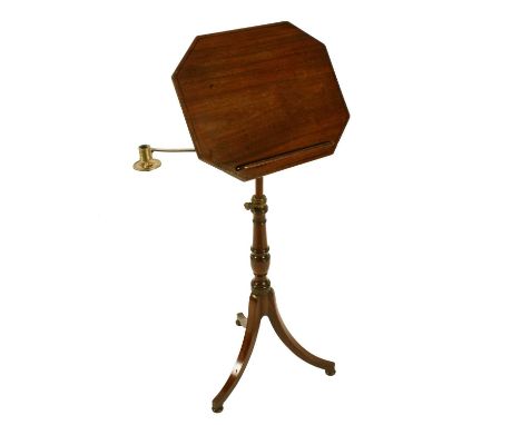 A George III mahogany adjustable tripod reading or music stand, c.1810, the octagonal top with line inlay and a removable boo