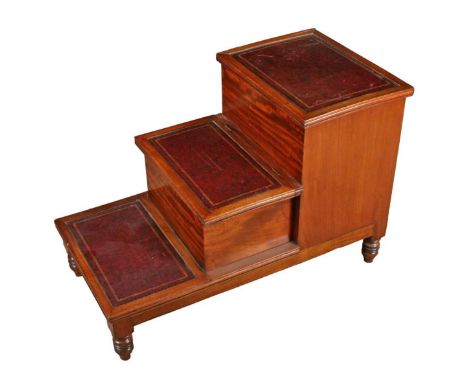 A George III mahogany bed steps, comprising three steps, all with red leather and gilt tooled insets, the middle step sliding