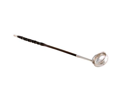 A George III Scottish silvered metal toddy ladle, c.1800, with spiral whalebone handle, 6 x 42.5cms long.PROVENANCE: The Grah