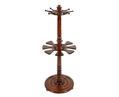 A rare late Georgian mahogany revolving boot and whip stand, the turned stem with a central revolving boot holding platform w