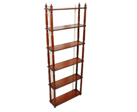 A set of tall Victorian mahogany wall hanging shelves, c.1860, the six rectangular shelves have semi-circular moulded edges a