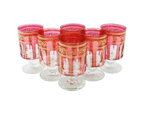 A set of six mid-20th Century Bohemian overlay wine glasses, the circular facet panel cut bucket-shaped bowls in clear glass 