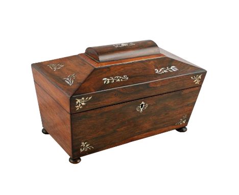 A Victorian rosewood inlaid and mother-of-pearl sarcophagus-shaped tea caddy, the hinged cover opening to reveal two tea comp