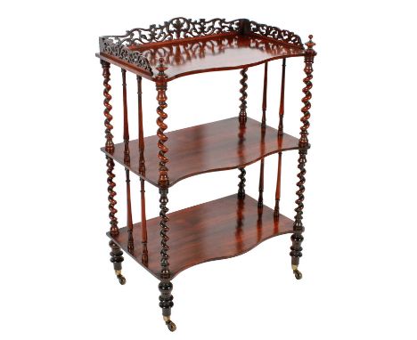 A Victorian rosewood three-tier serpentine fronted whatnot c.1860, with turned spiral and spindle supports, the top shelf wit
