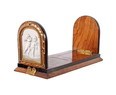 A Victorian burr walnut and gilt metal mounted folding book slide, c.1860, with ceramic panels at each end depicting a pair o