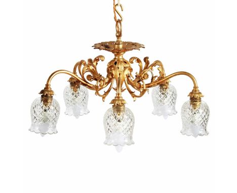 An ornate early 20th Century five-branch ormolu chandelier, the shaped scrolling arms with acanthus decoration and shaped cut