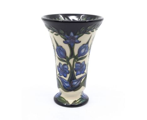 Moorcroft Pottery: A Moorcroft numbered edition 'Kaffir Lily' vase designed by Shirley Hayes. Height approx 15.5cm. Impressed