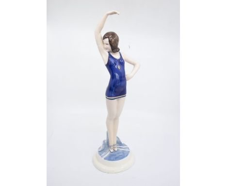 &nbsp;Goldscheider figure of a young lady in a swimming costume. Signed Dakon. Height approx 40cm. Repair to raised arm.