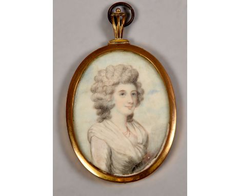 An early 19c oval portrait miniature on ivory of a lady, framed and glazed, 2.25in x 1.75in.