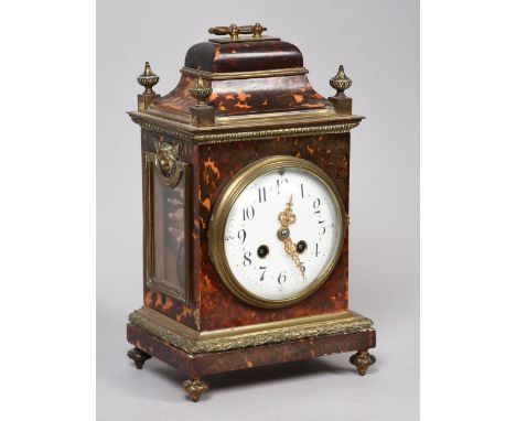 A late 19c French mantel clock, the two train movement rack striking on a gong and having a 5in diam white enamel convex dial