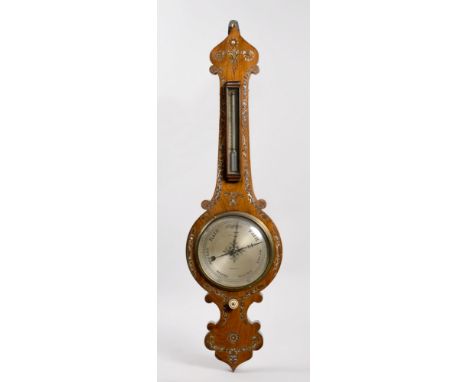 A mid 19c tulip top wheel barometer, the 8in silvered dial signed Mansfield, Shaftsbury.  The case is rosewood, inlaid with m