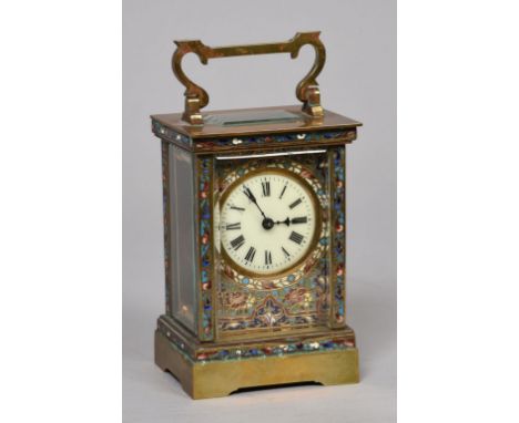 A late 19c French carriage timepiece in rectangular glazed brass case, inlaid with blue ground champleve enamel and having a 