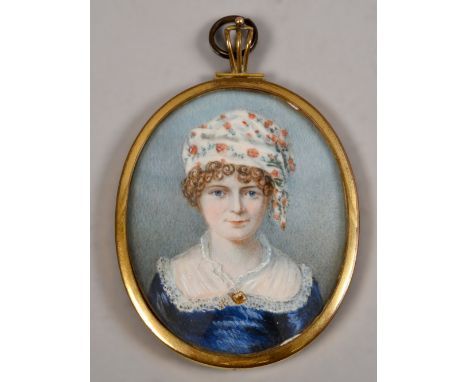 A 19c oval portrait miniature on ivory of a lady, she wearing a floral decorated round eared cap, oval framed, 3in x 2.5in.