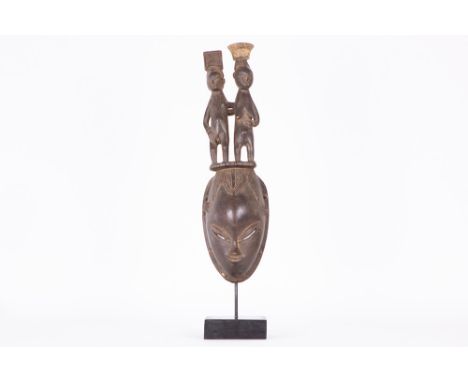 African Ivory Coast oval wedding mask with a female and male figure on the top, from the Dan of the Bouafle regioAFRIKA / IVO