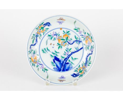 Chinese plate in marked porcelain with a polychrome garden decorChinees bord in gemerkt porselein met een polychroom tuindeco