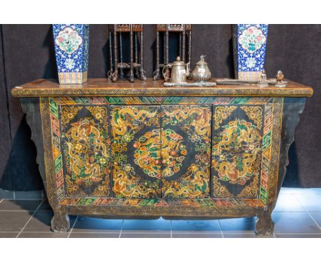 antique Sino-Tibetan Qing period two doors sideboard in black lacquered wood with a coromandel decor with dragonsCHINA  -  QI