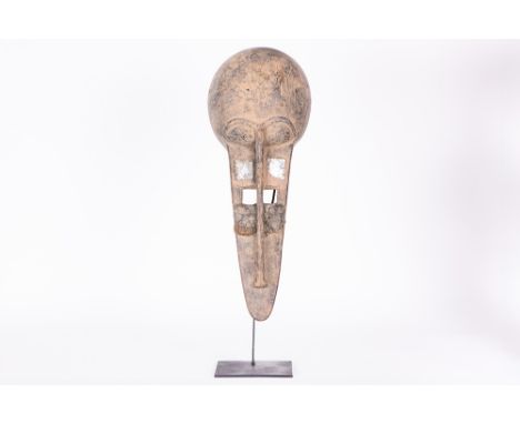 African Ivory Coast Senufo mask in wood with inlaid eyes (in different layers, including mirror glass to increase the magical