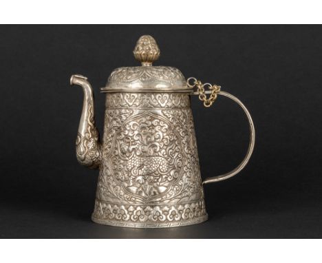 old Tibetan lidded (tea)pot in silver with repoussé decor with typical motifs such as mythical animalsTIBET  -  ca 1900/40 ge