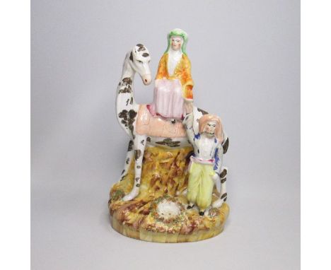 A rare Staffordshire figure of Lady Hester StanhopeCirca: 1850Size: 27cm HCondition: Restoration to cup in man’s right hand, 