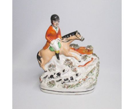 A Staffordshire figure of a Huntsman, fox huntingCirca: 1850Size: 20cm HCondition: Rider's head re attached, nose & hat scuff