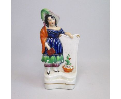 A Staffordshire Crimean War figure of a soldier’s wife leaning on a gravestone.Circa: 1855Size: 18.5cm HCondition: The rim of