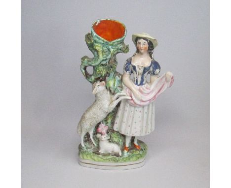 A Staffordshire Spill figure of a Rural lady with sheepCirca: 1880Size: 24cm HCondition: Chip to hat, paint flakesProvenance: