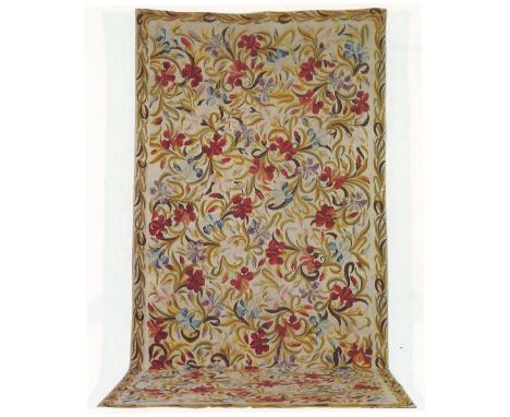An English Needlepoint CarpetWoven with interlaced lilies within a foliage border, 557cm x 262cm Footnotes:Provenance: Christ