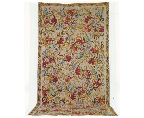 An English Needlepoint CarpetWoven with interlaced lilies within a foliage border, 557cm x 262cm Footnotes:Provenance: Christ