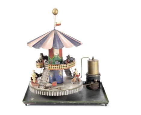 Tinplate steam fired Double Carousel, German circa 1890,Lower tier with four red chairs and two lead horses, steps to upper t