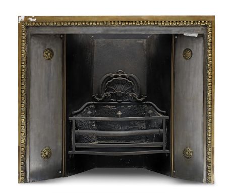 A George III Cast Iron and Brass Register GrateThe basket enclosed by steel panels embellished by patera, 112cm wide x 48cm d