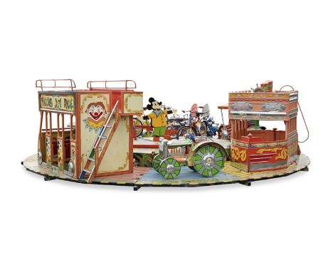 A mid-20th century painted wood and metal children's fairground carouselThe circular wooden base mounted with rides including