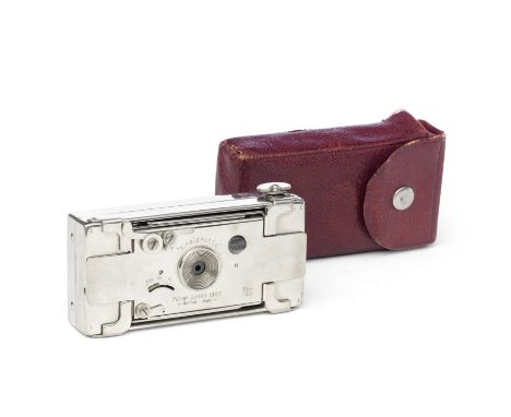 A Houghton Ltd. Ensignette Camera,2 1/4 x 1 5/8in,  with red leather bellows and plated metal body in original leather carryi