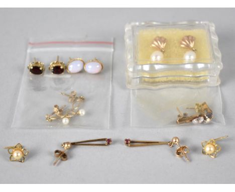 A Collection of Seven Pairs Various 9ct Gold and Yellow Metal Jewelled Earrings to include Pearl, White Stone, Garnet, Dragon