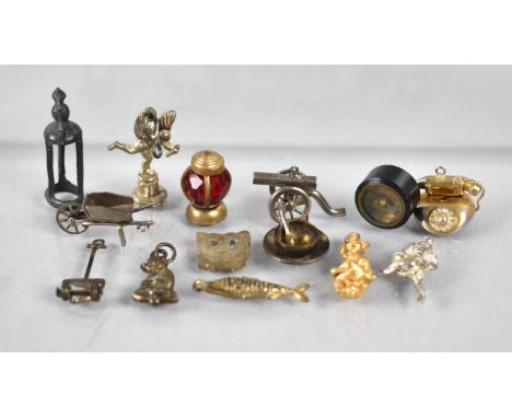 A Collection of Various Novelty Charms and Sundries to include Miniature Compass with Screw Base Fixing, Glass Cat Mask, Whee