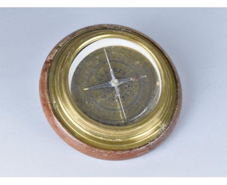 A Circular Brass Compass Mounted on Wooden Plinth, 14.5cms Diameter 