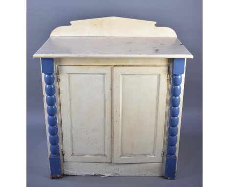 A Late 19th Century Painted Cabinet with Bobbin Pilasters and Panelled Doors, 94cms Wide 