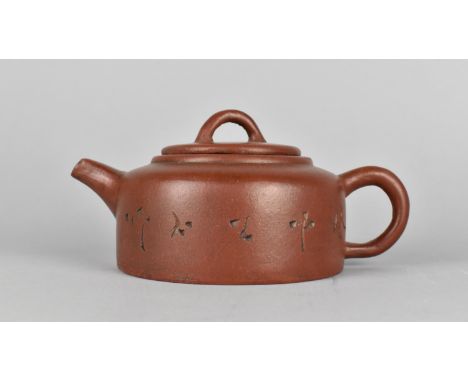 A Chinese Yixing Teapot with Incised Decoration to Body, Seal Mark to Base and Makers Marks to Lid, 19cm long 