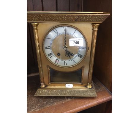 Brass enclosed four pillar mantel clock with brass movement 
