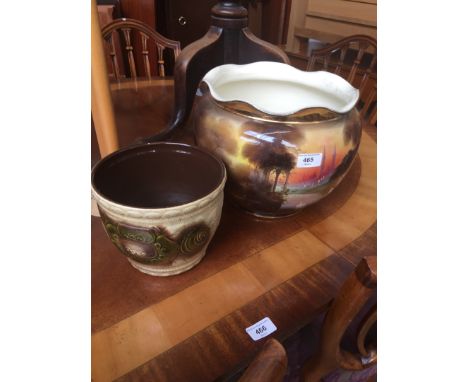 A porcelain jardinière decorated with an orientalist scene and a small west German planter. 